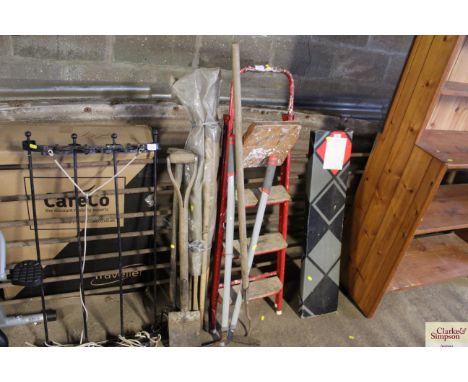 A small pair of steps; drainage rods and long handled tools