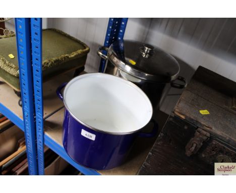 An enamel cooking dish and a stainless steel cooking pan and cover