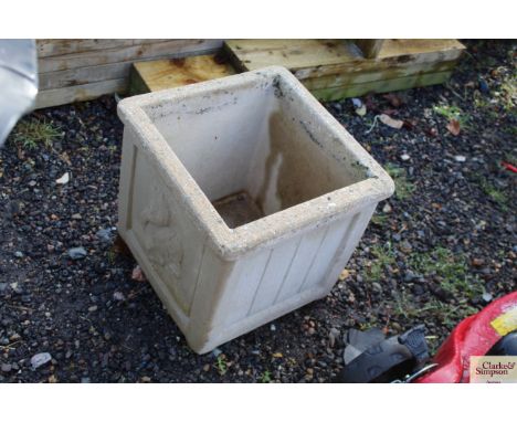 A rectangular concrete garden planter
