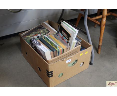A box of various books to include vintage Penguin books
