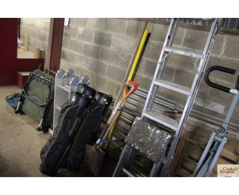 A quantity of long handled gardening tools