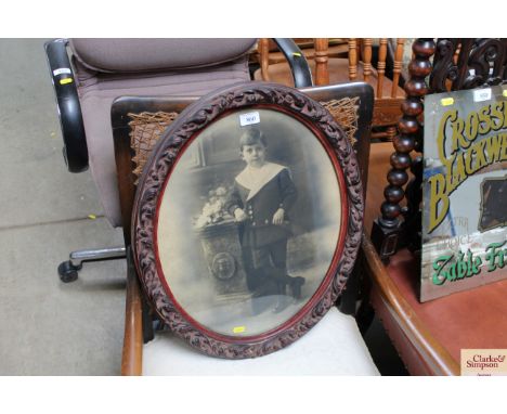 A black and white portrait contained in oval frame