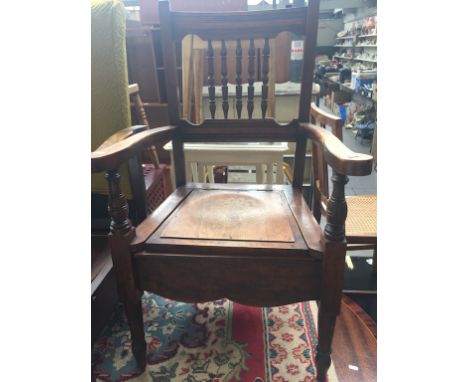 AN EDWARDIAN COMMODE CHAIR
