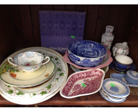 SHELF OF DECORATIVE POTTERY