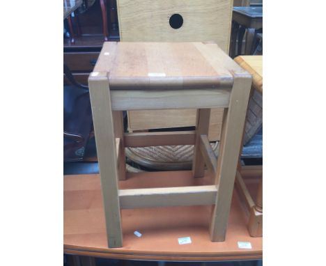 A WOODEN STOOL
