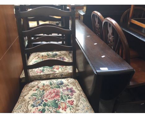 AN ERCOL DROP LEAF TABLE AND FOUR CHAIRS