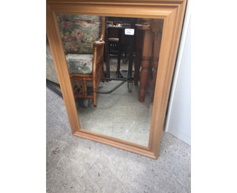 A MODERN FRAMED MIRROR