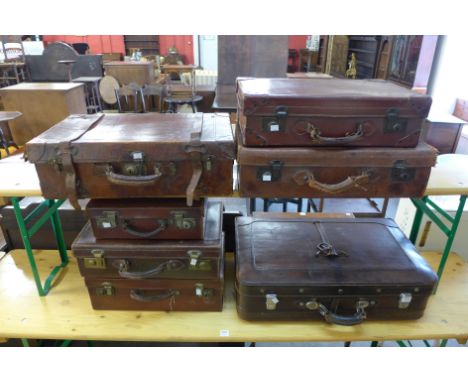 Seven assorted vintage suitcases