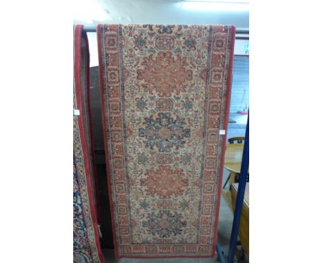 A red ground runner rug