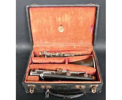 A vintage 20th century Westminster Boosey and Hawkes clarinet having chrome keys and wooden shaft. Comes in a hard cover carr