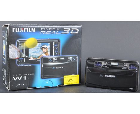 A Fujifilm FinePix Real 3D W1 Digital Camera. Camera boxed and accompanied by original paperwork and charger. measures 125mm 