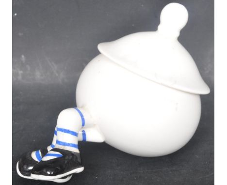 A vintage 20th century Lustre Carltonware walking pot having a circular lid to the top with blue and white leg. Makers mark t