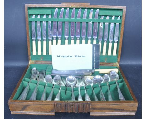 A 1930's Art Deco oak cased Mappin &amp; Webb silver plated canteen of cutlery. The decorative case with baize lined interior