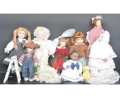 A collection of vintage 20th century dolls to include Camera Shy Chloe and a Franklin Heirloom doll in christening outfit and