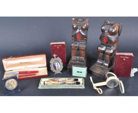 A collection of vintage 20th century curios comprising of a miniature prayer book set, miniature religious picture, a compass