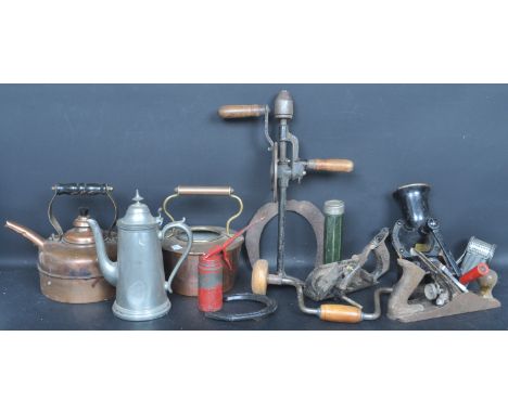 A large collection of vintage 20th century copper and metal ware comprising of a cast metal grinder by Spong &amp; Co, two co