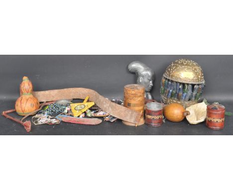 A large collection of 20th century Tribal pieces to include musical instruments, beadwork, a copper and brass light shade, a 