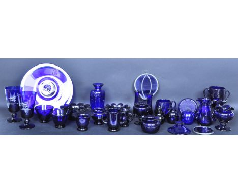 A large assortment of retro vintage 20th century Bristol Blue glass ornaments and items to include pots, candlesticks, paperw
