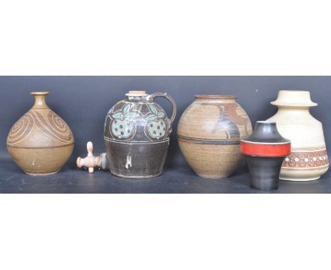 A collection of vintage 20th century studio art pottery comprising of a vase, water tank, and more. Collection includes a sma