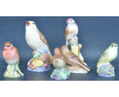 A collection of vintage 20th century Royal Worcester ceramic bird figurines comprising of Thrush, Wren, Linnets, Wood Warbler