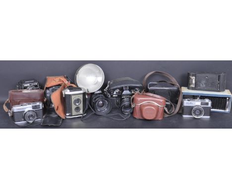 A large collection of vintage 20th century photographic camera equipment to include Pentax Asahi ESII, Zenit EM, Minolta Hi-M