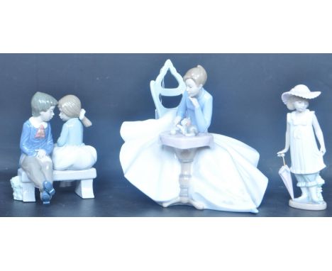 An assortment of vintage 20th century Nao Spanish porcelain figures to include First Love No.1136,&nbsp; April Showers No.112