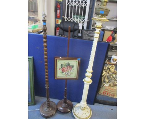 Two standard lamps to include a cream and gold painted lamp with oil burner to the top together with a mahogany pole screen 