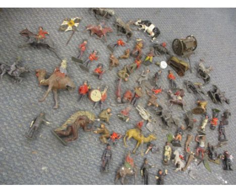 An assortment of vintage lead figures, in well-played condition to include Britains Beefeaters, Middle Eastern figures, West 