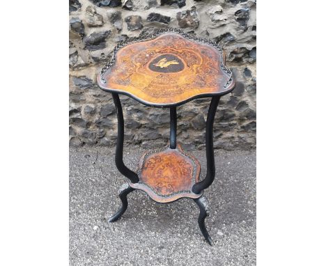 A Victorian marquetry inlaid occasional tripod table, the shaped top with inlaid bird and scrolls, mounted with a pierced gal