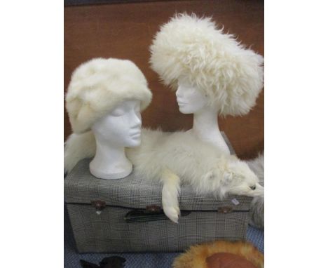 A 1970's brown leather sheepskin hat with faux fur trim, a similar hat with red fox fur trim, a mid 20th century Marshall &am