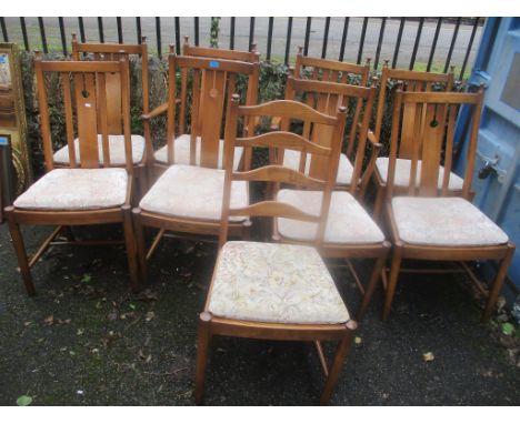 A set of eight Ercol elm Golden Dawn dining chairs together with a single ladder back chair