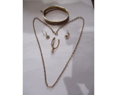 A yellow metal bangle stamped 1/6th 9ct gold core bangle together with an 18ct gold chain, 6.9g and a gold coloured pair of e