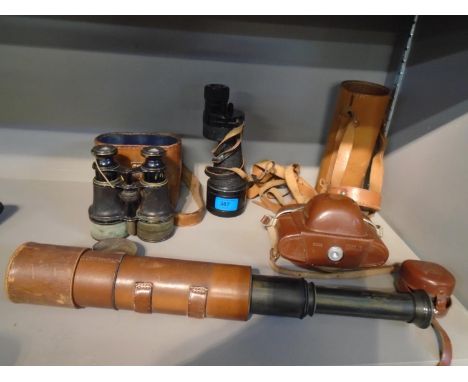 A leather clad four drawer four drawer lacquered brass John Browning, London telescope with military issue arrow, and leather