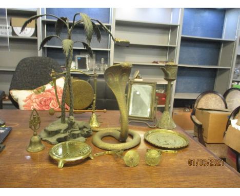 A mixed lot of metalware to include a large brass snake ornament and a palm tree island ornament, a brass Dutch oil lamp, bra
