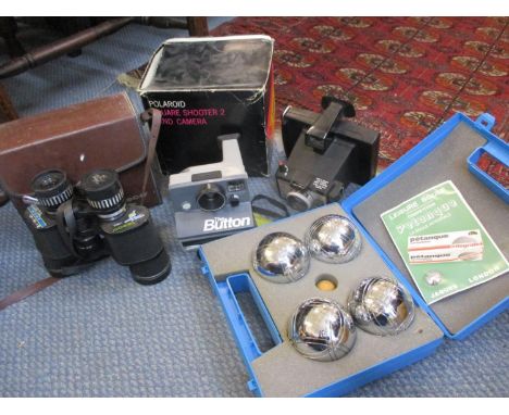 Retro cameras to include The Button and a Polaroid Square Shooter together with Tasco binoculars and a game of Petanque toget