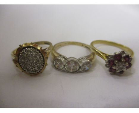 Two 9ct gold rings to include one inset with three paste stones and a diamond chip ring, total weight 7g together with an 18c