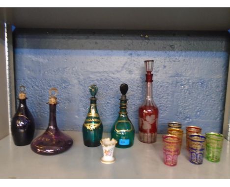 A group of 19th century coloured glass spirit and liqueur decanters to include Bristol green Hollands and Rum decanters with 