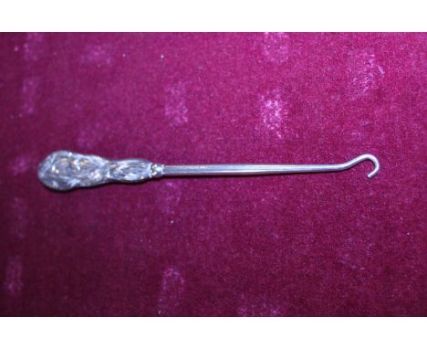A hallmarked silver handled button hook 