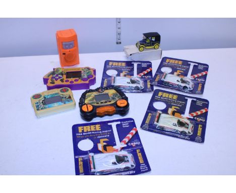 A selection of sealed racing car models and other handheld games 