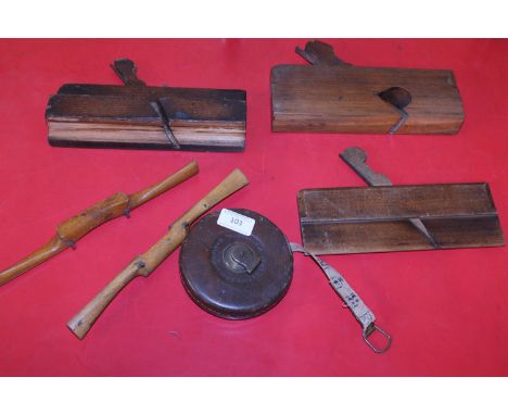 A selection of vintage woodworking tools including a Rathbone cased tap measure 