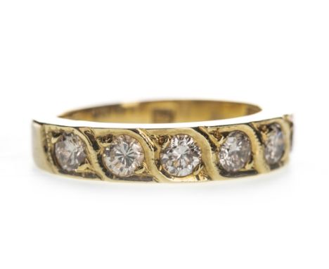 DIAMOND SET BAND, set with round brilliant cut diamonds totalling approximately 0.70 carats, in eighteen carat gold, size K, 