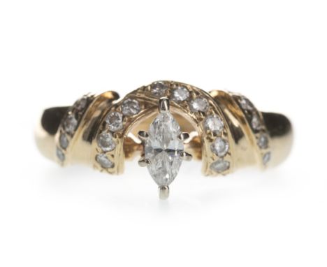 DIAMOND DRESS RING, set with a central marquise diamond of approximately 0.20 carats, within a crescent shaped bezel set with