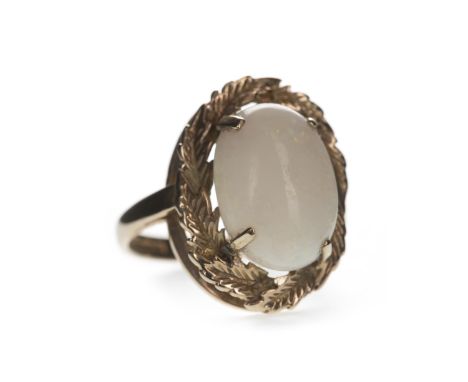 OPAL RING, set with a cabochon opal 14mm long, within a foliate motif border, in nine carat gold, size M, 4.7g