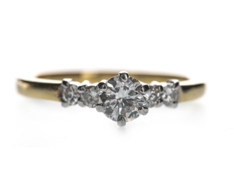 DIAMOND DRESS RING, set with a round brilliant cut diamond of approximately 0.42 carats, flanked by two diamonds on each shou