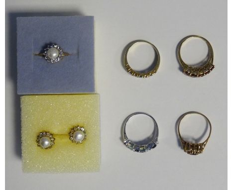 9ct gold, diamond and amethyst-coloured circular cluster ring, a white metal dress ring set multiple blue stones, a 9ct gold,