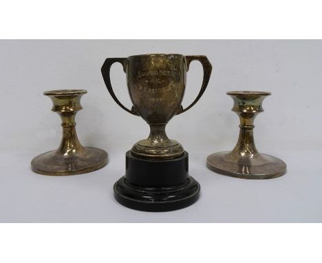 Pair of 1920's silver-mounted squat candlestick holders, Birmingham, makers J&C and a two-handled silver trophy cup 'Oakwood 