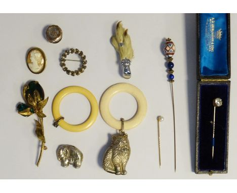 15ct gold and pearl hatpin, 1.5g, boxed, a cameo brooch, a mounted claw brooch, various other brooches, hatpins, silver rattl