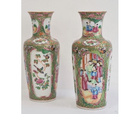 Pair of Chinese Canton baluster vases, each painted in a typical palette with figures on terracing alternating with birds on 