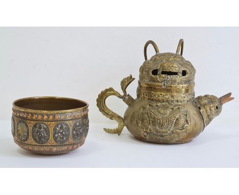 Asian brass teapot, cover and bowl, probably Tibetan, late 19th/early 20th century, the teapot with beast mask spout and scro