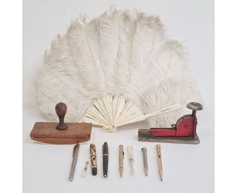 Bone and white ostrich feather fan, a blotter, a stapler, a Waterman Ideal fountain pen, 2 Mont Blanc fountain pens and two p